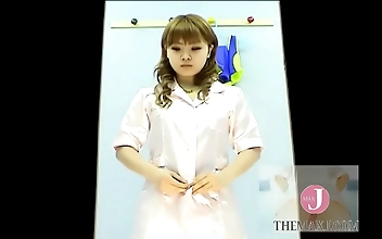 Experience the Alluring Japanese Model Tamago as She Changes Clothes in Voyeuristic Scene